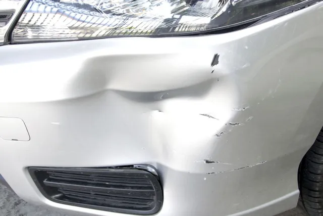 Minor front bumper damage on vehicle needing collision repair in Watervliet NY
